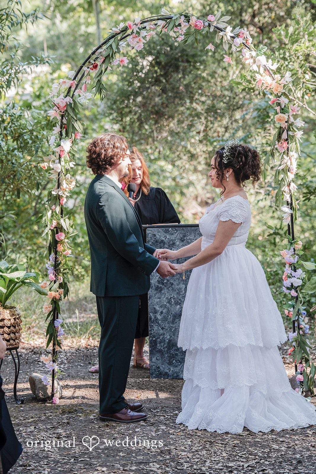 Keely + Sam Couple exchanging vows during ceremony