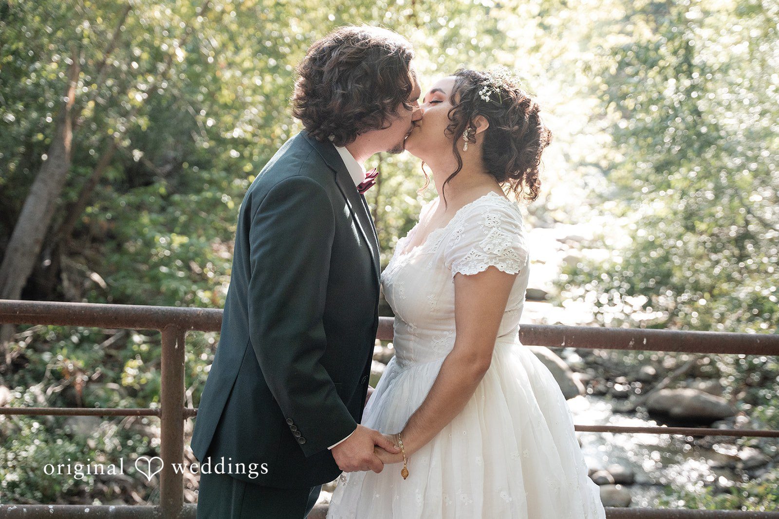 Keely + Sam A candid shot of couple sharing a kiss