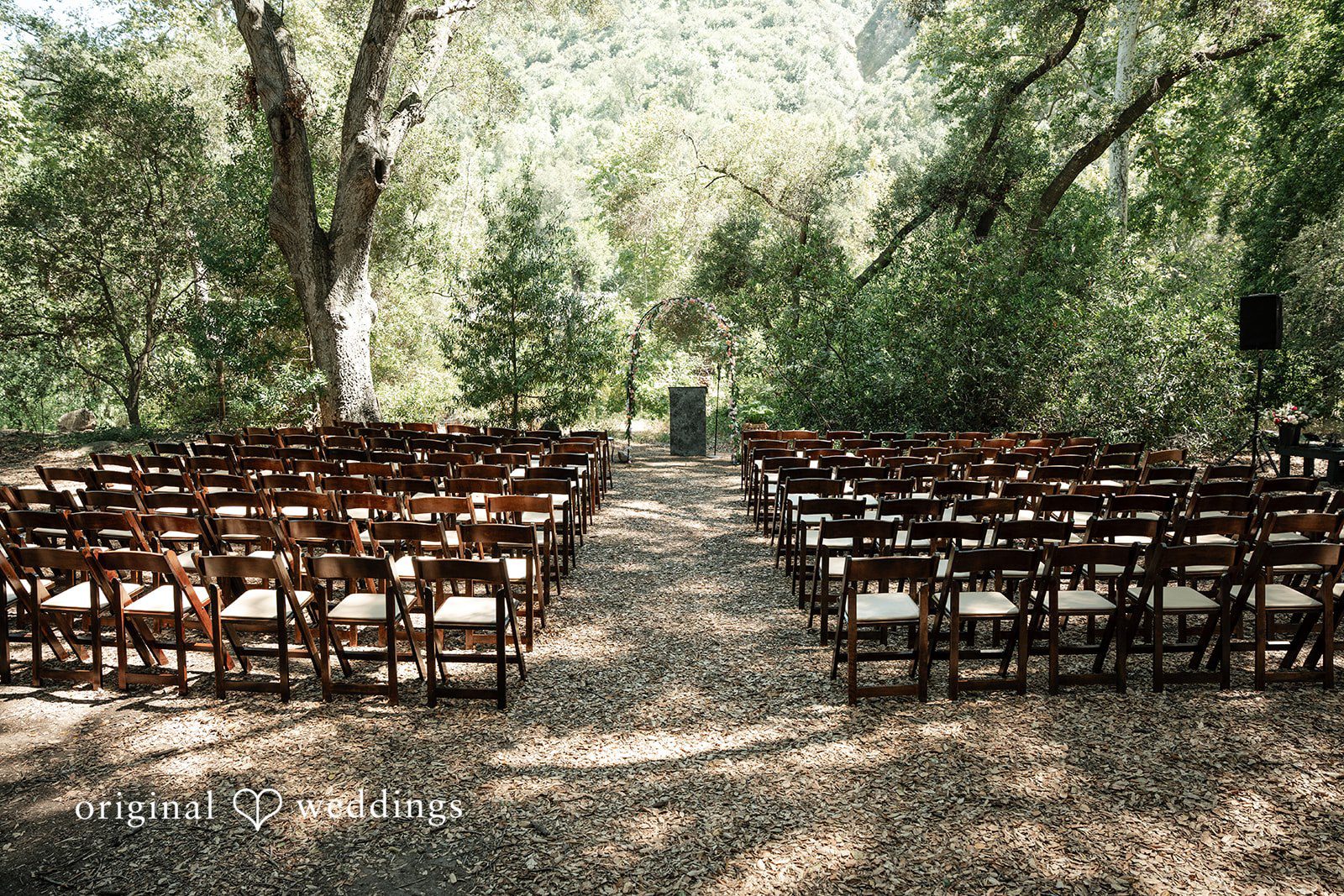 Keely + Sam Scenic view of seating arrangement and altar at Camp Bartlett