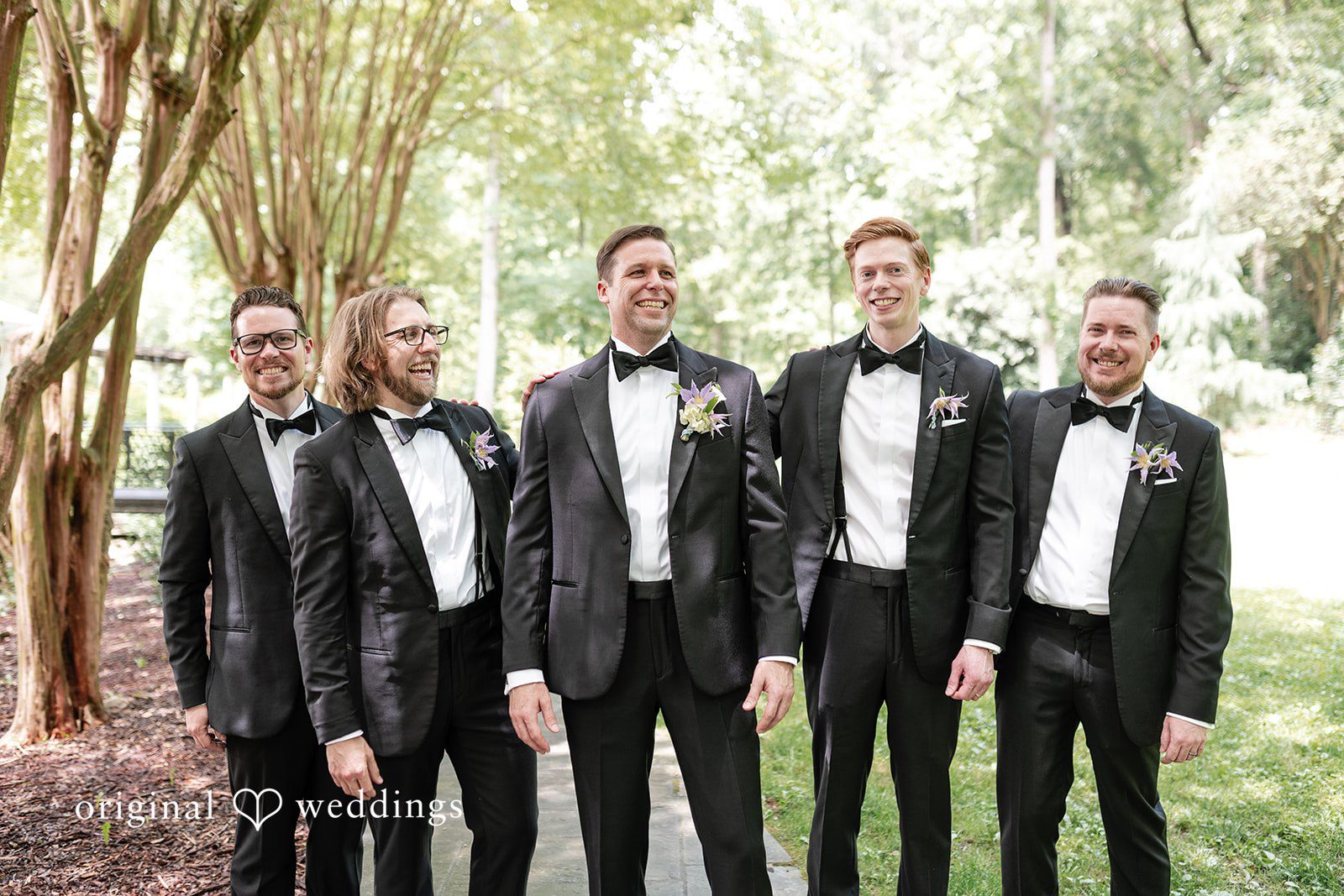 Groom posing with groomsmen