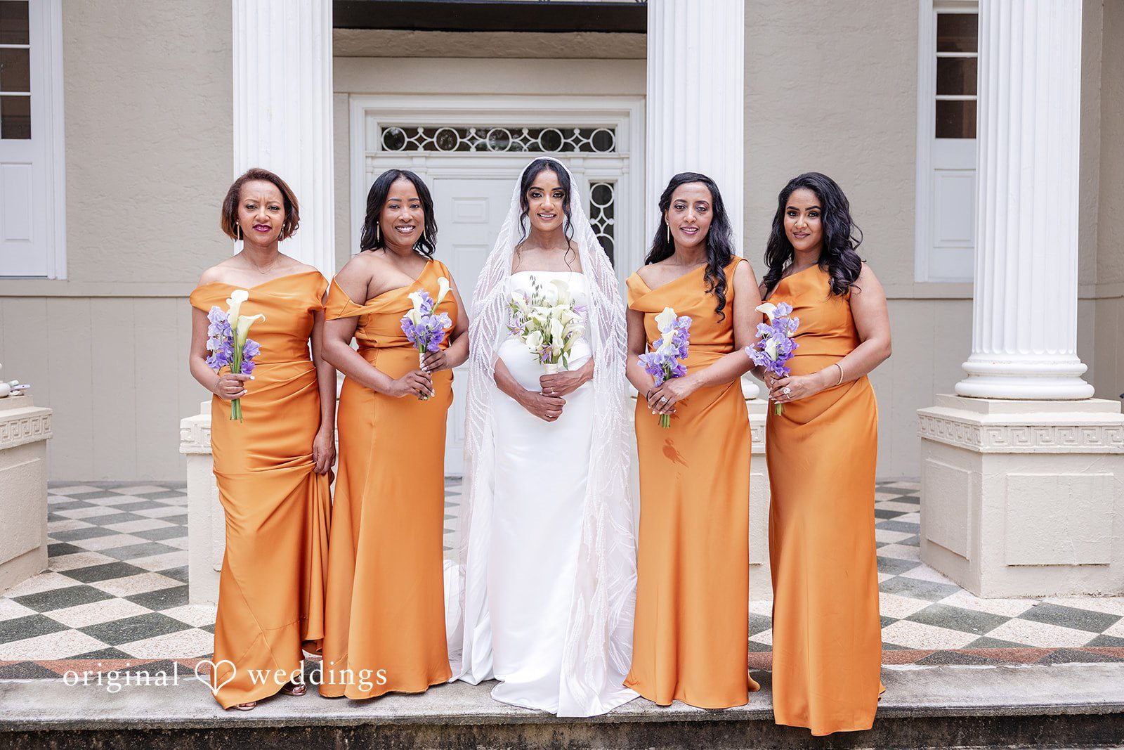 Bride posing with bridesmaids
