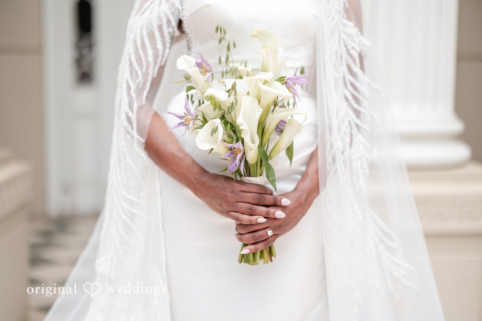 Close-up wedding florals in bride’s hands