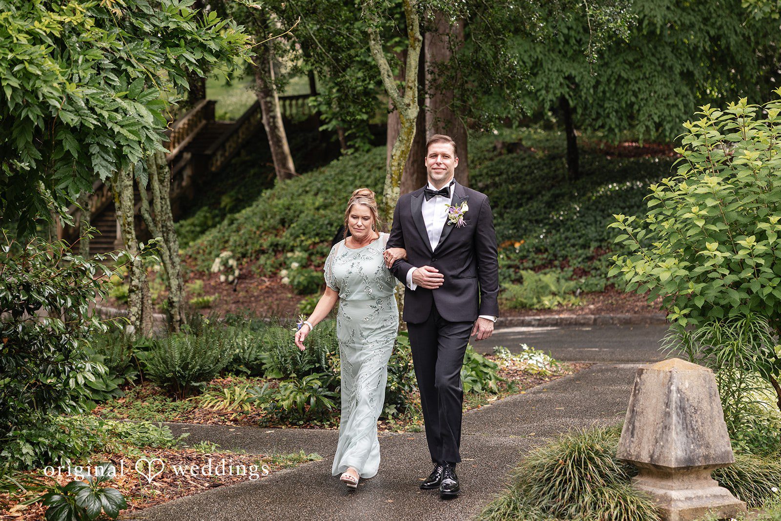 Groom entrance photo surrounded by greenery and landscaped gardens.