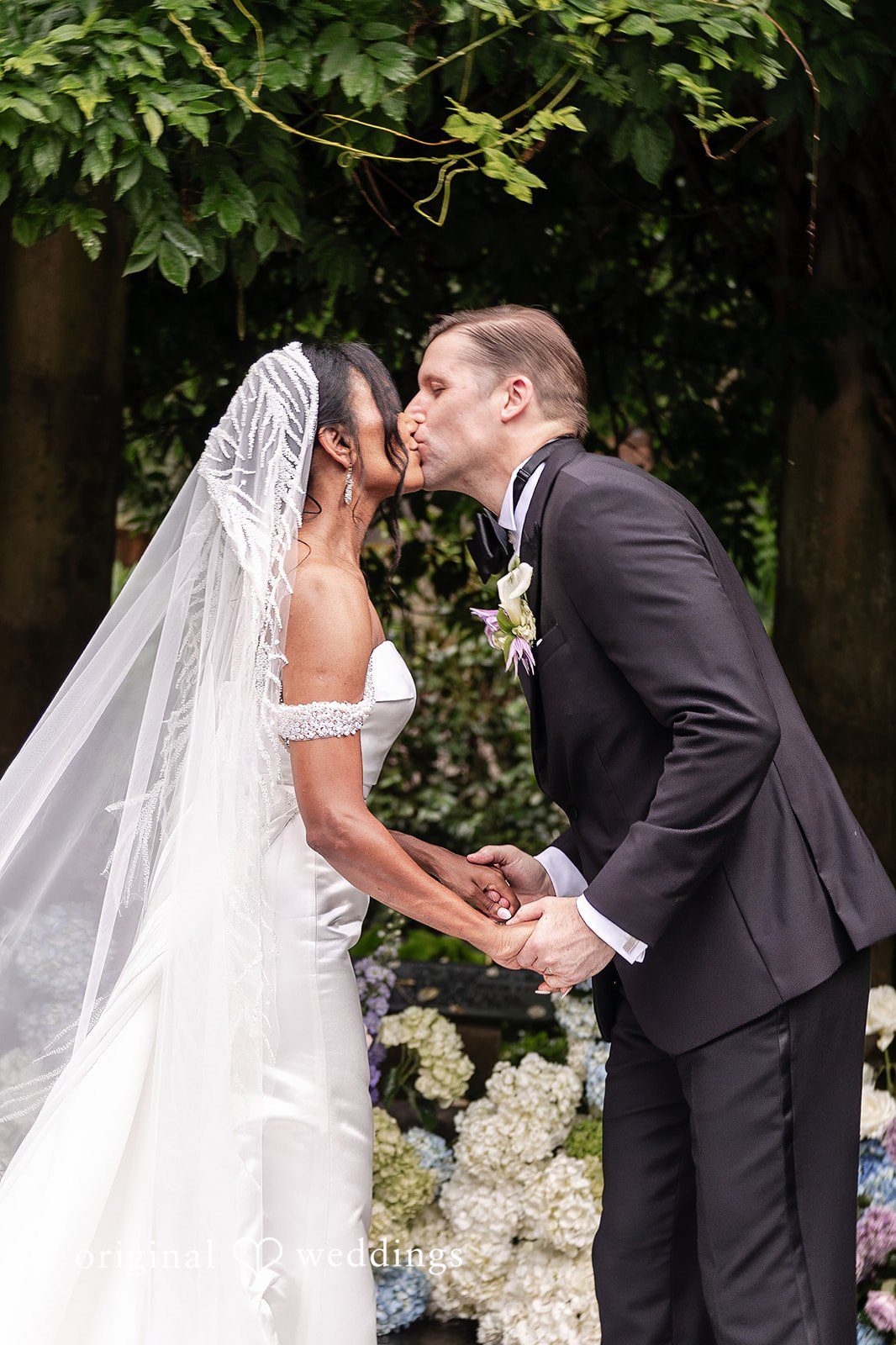 Romantic first kiss moment captured at Cator Woolford wedding