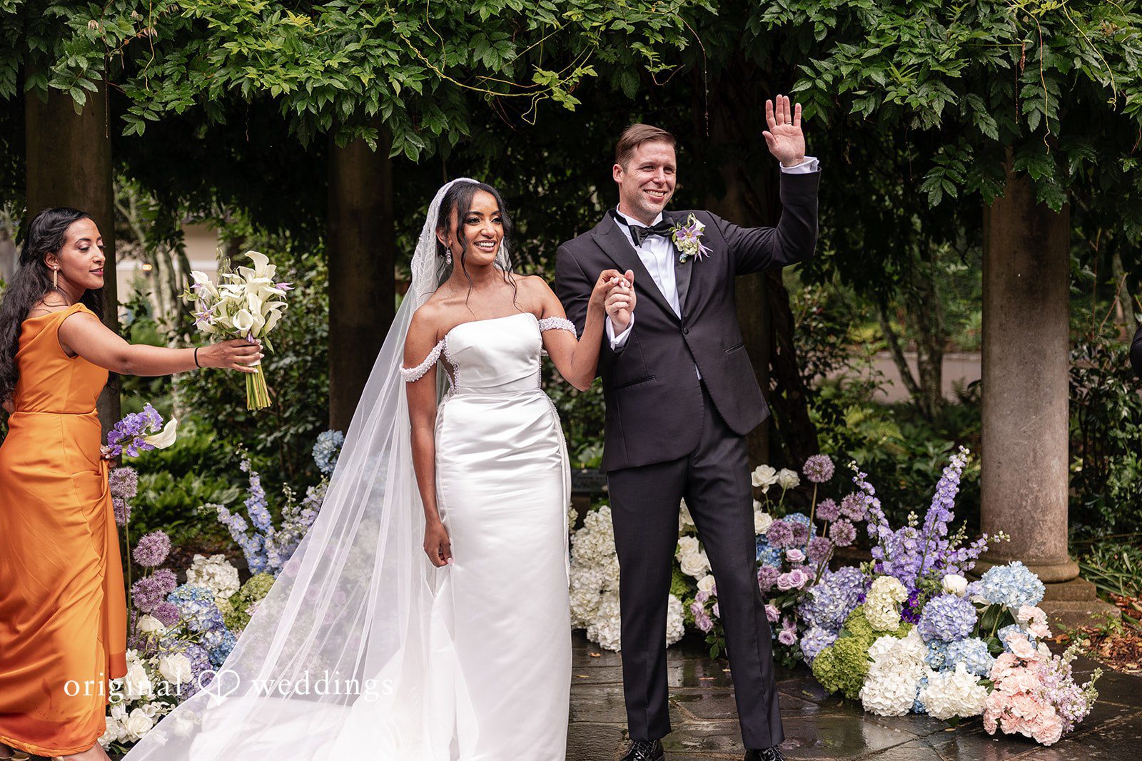 Newly married couple walking down aisle after ceremony celebration at Cator Woolford Wedding Captured by Atlanta Wedding Photographers from Original Weddings