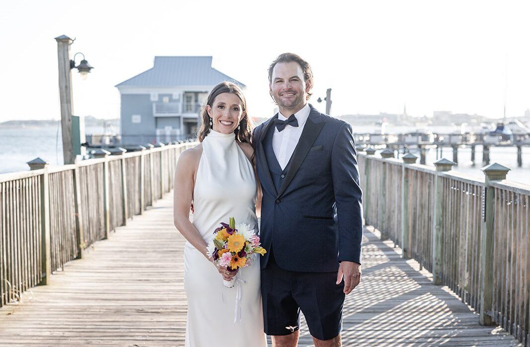 Original Weddings couple portrait captured by Charleston Wedding Photographers at Charleston Harbor Resort and Marina during a waterfront wedding celebration