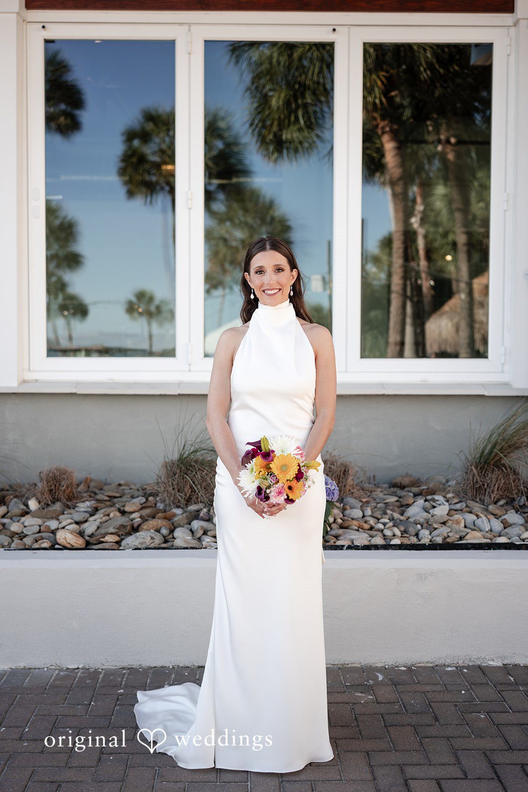Kellie + AJ Bride holding her bouquet during a wedding portrait
