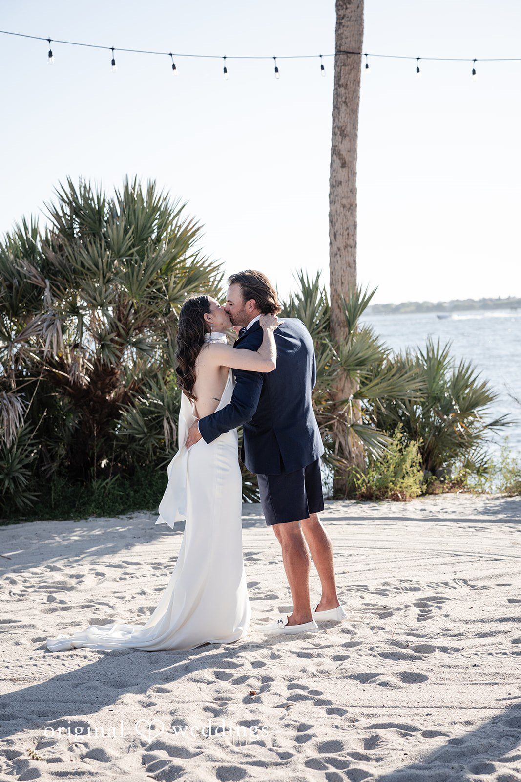 Kellie + AJ Newlyweds sharing their first kiss after exchanging vows