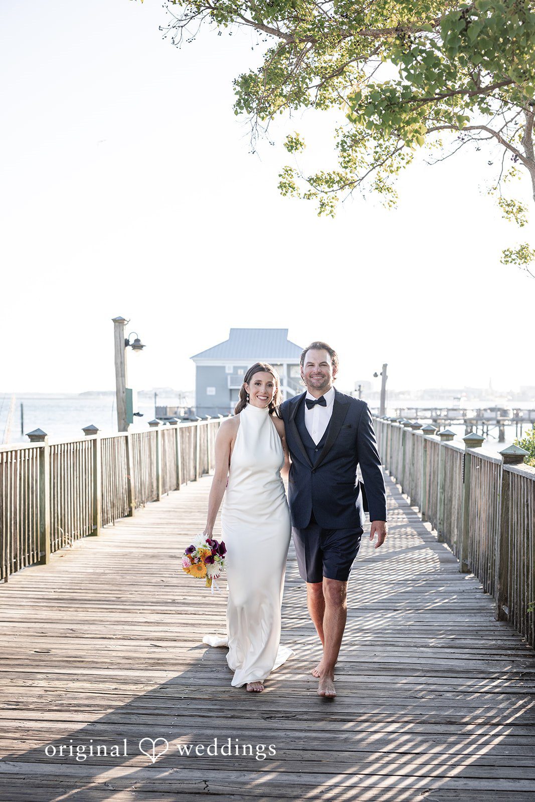 Kellie + AJ Bride and groom walking toward the reception venue