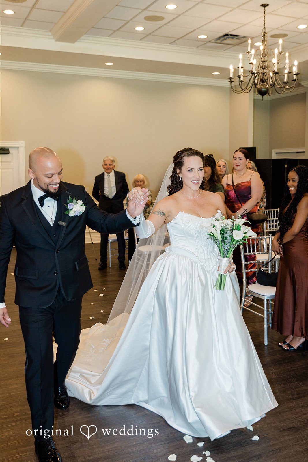 Kristen + Robert The couple makes a grand entrance to their wedding reception