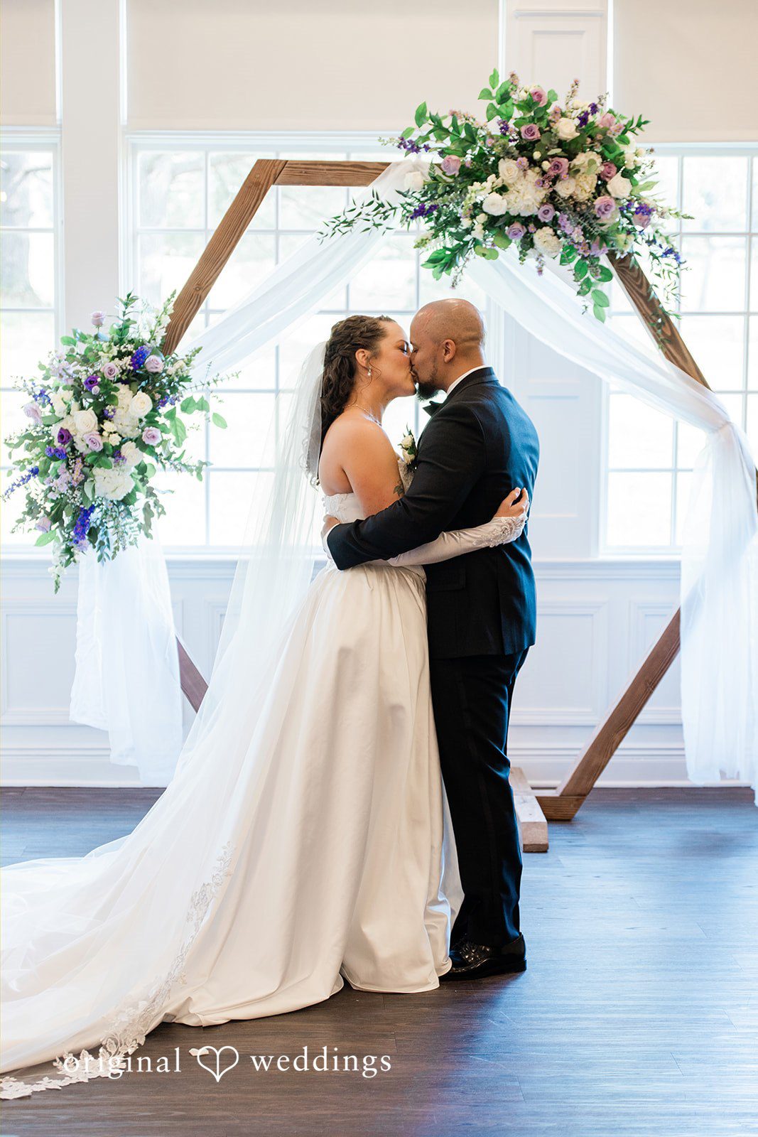 Kristen + Robert Our Philadelphia wedding photographers captured the moment the couple shared a kiss to seal their union