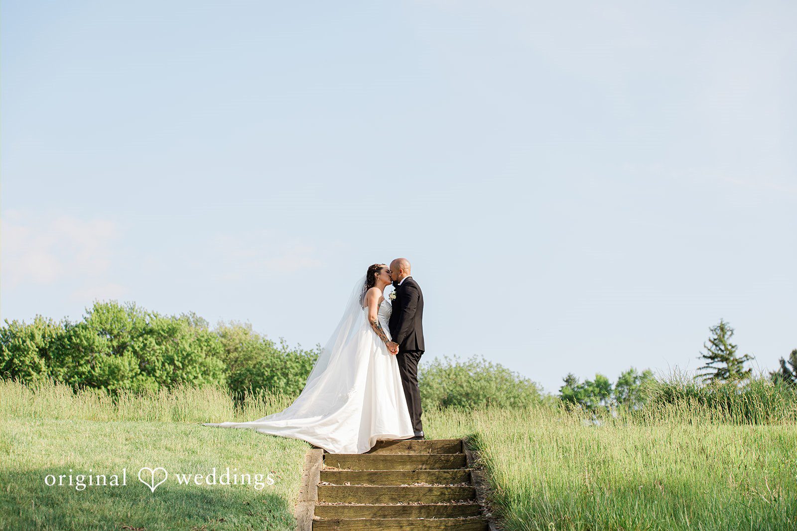 Kristen + Robert A romantic portrait of the couple framed by the beauty of nature at Coatesville Country Club