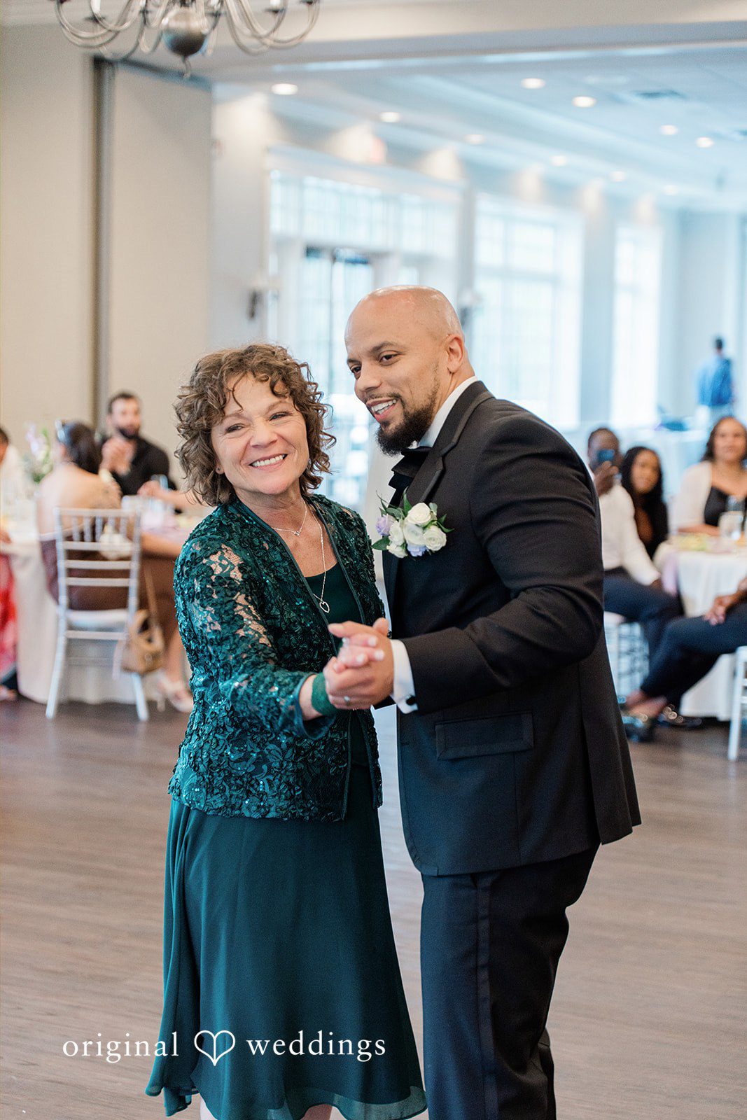 Kristen + Robert The groom takes a dance with his mother
