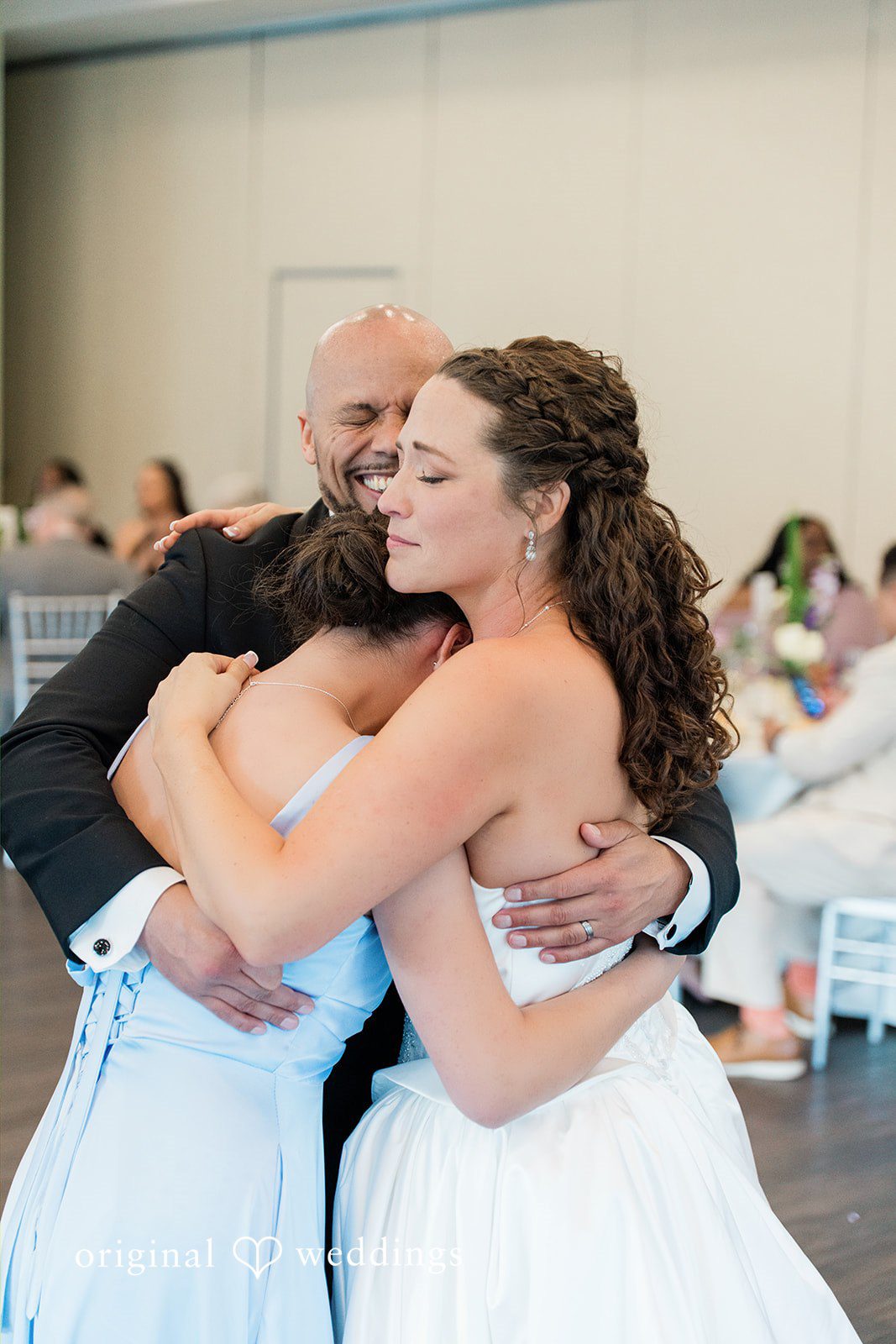 Kristen + Robert Warm embrace with family