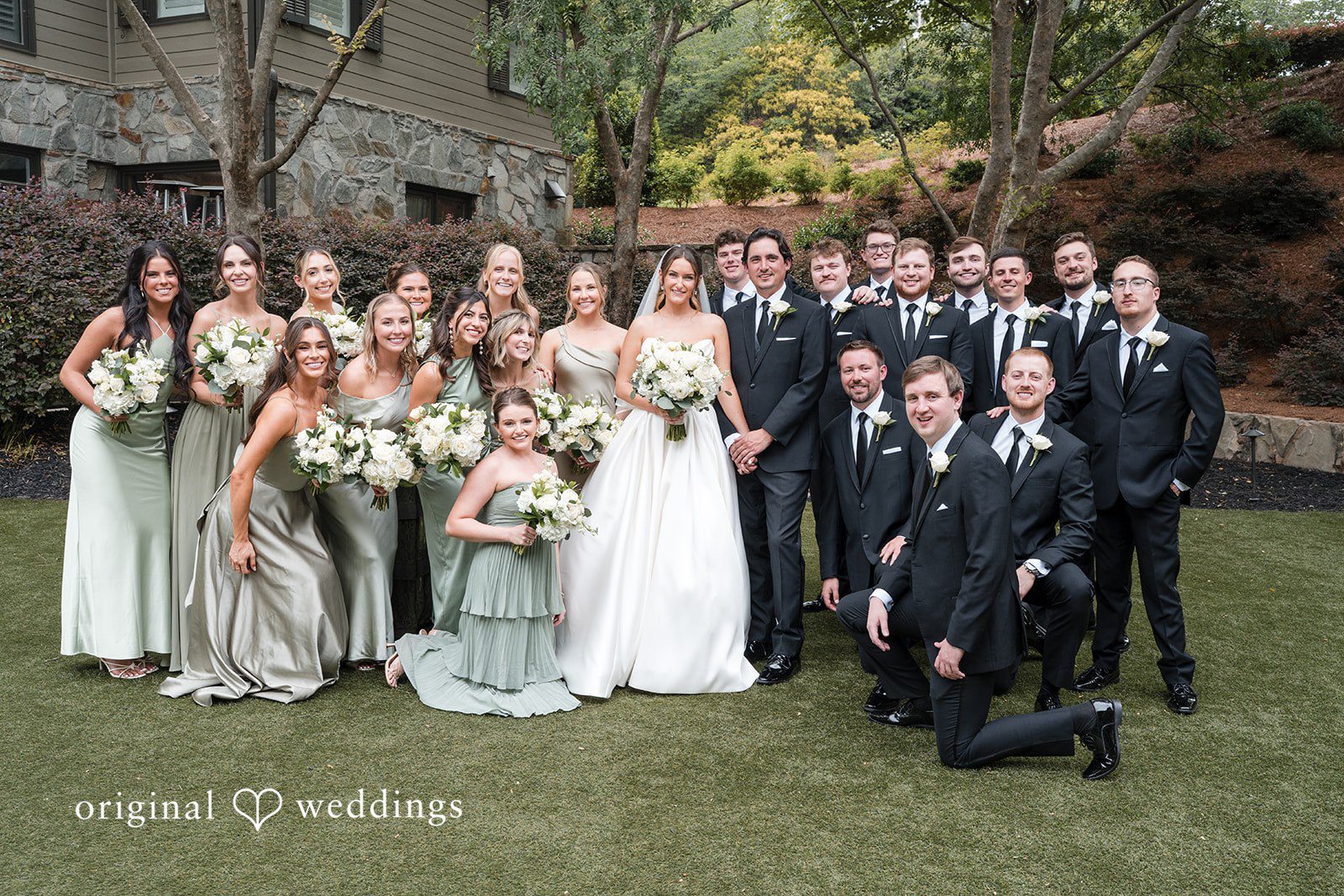 Megan + Grant Our Atlanta wedding photographers at Original Weddings captured a stunning portrait of the couple and their bridal party at the Country Club of the South