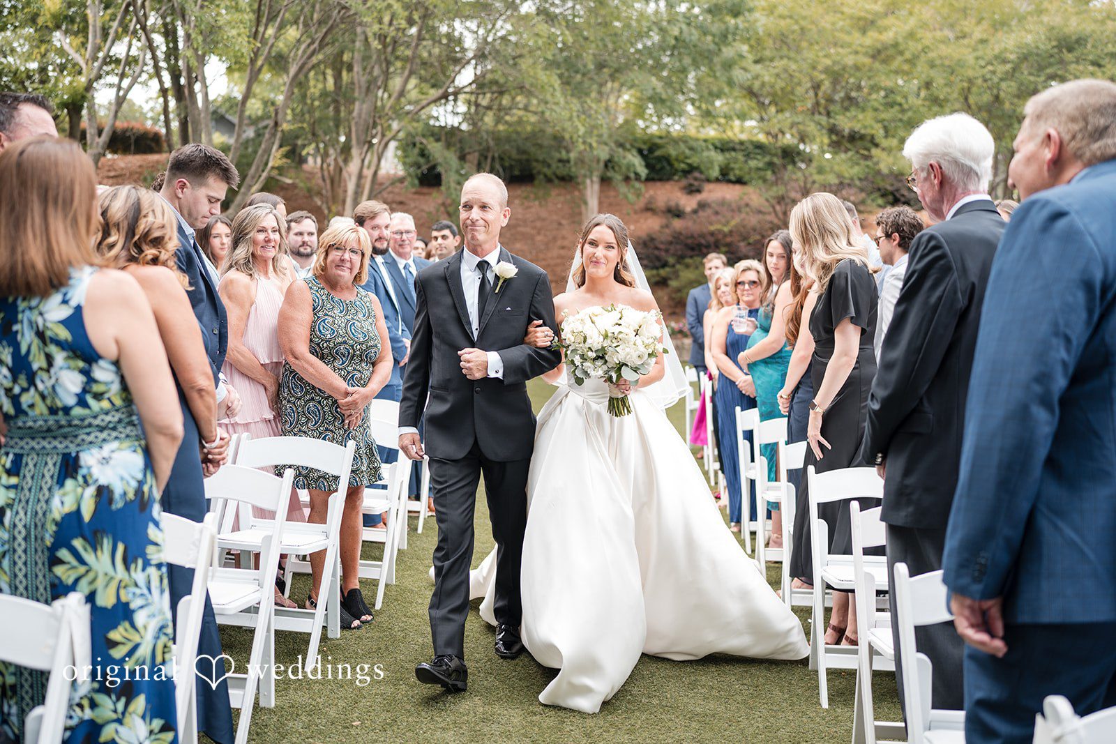 Megan + Grant Our Atlanta wedding photographers captured the moment the bride's father escorted the bride down the aisle