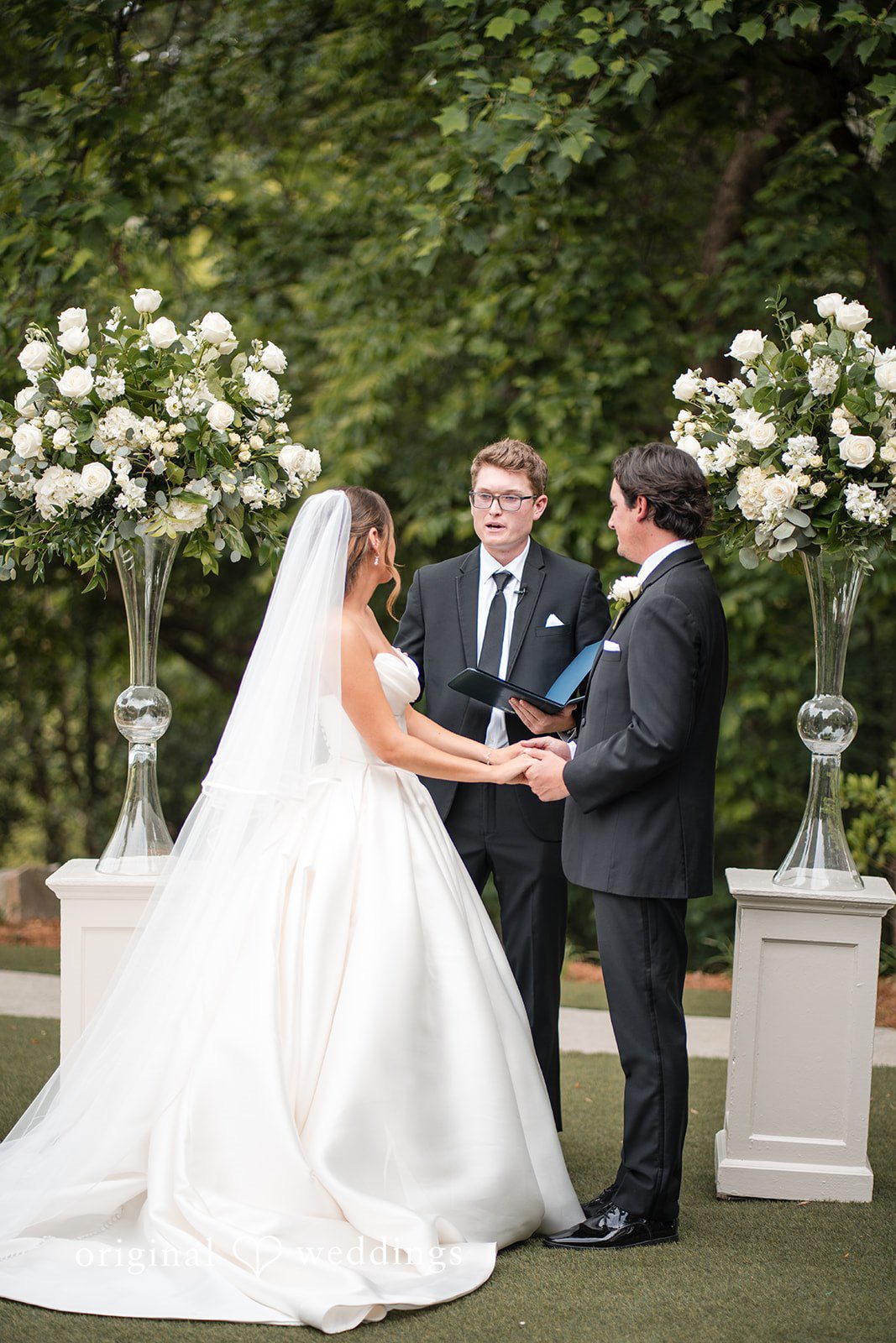 Megan + Grant The priest presides over the union