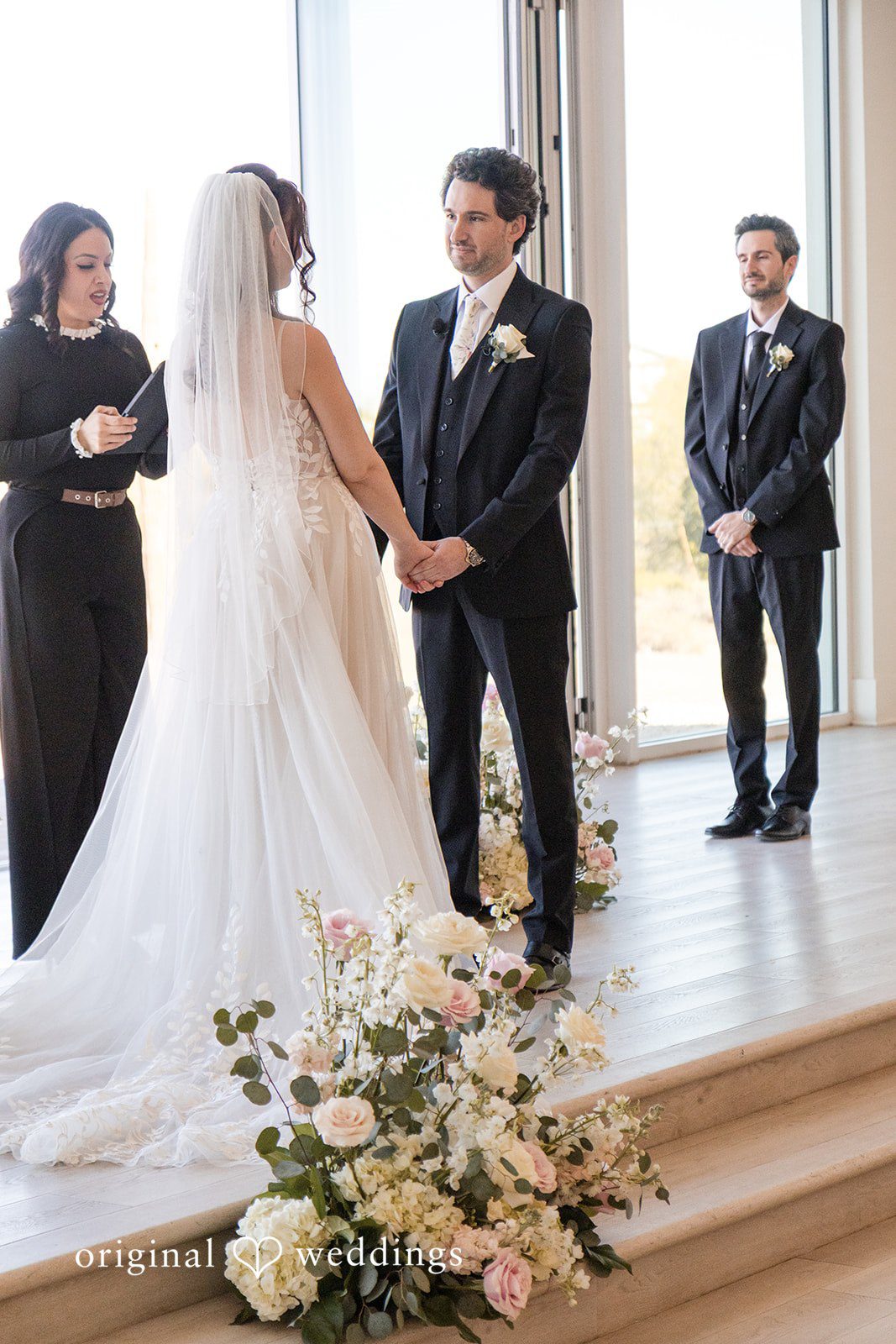 Jared + Jessica Bride and groom exchanging vows while holding hands during ceremony at Desert View Weddings & Events captured by Phoenix wedding photographers from original weddings