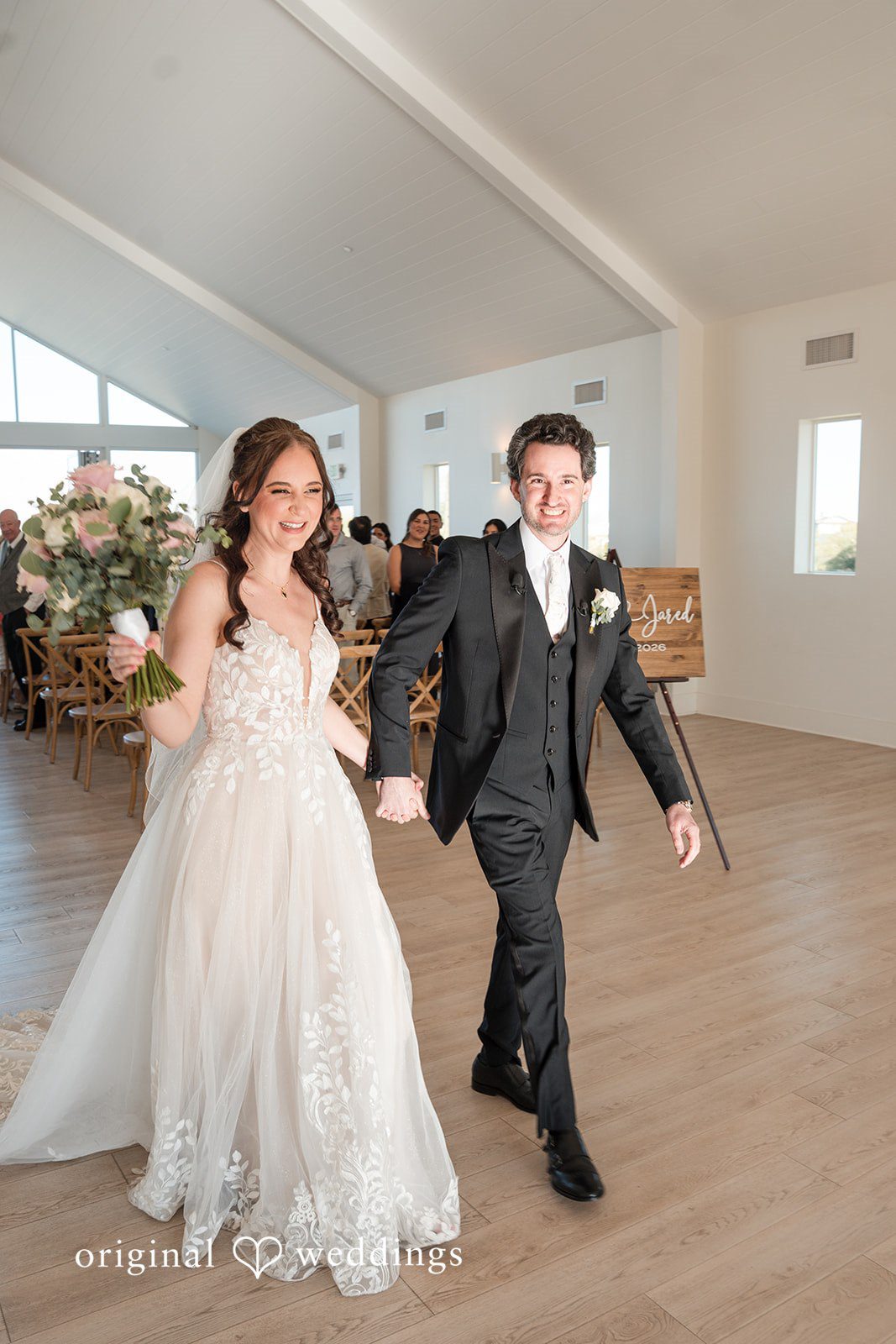 Jared + Jessica Lovely couple entering the hall for wedding reception