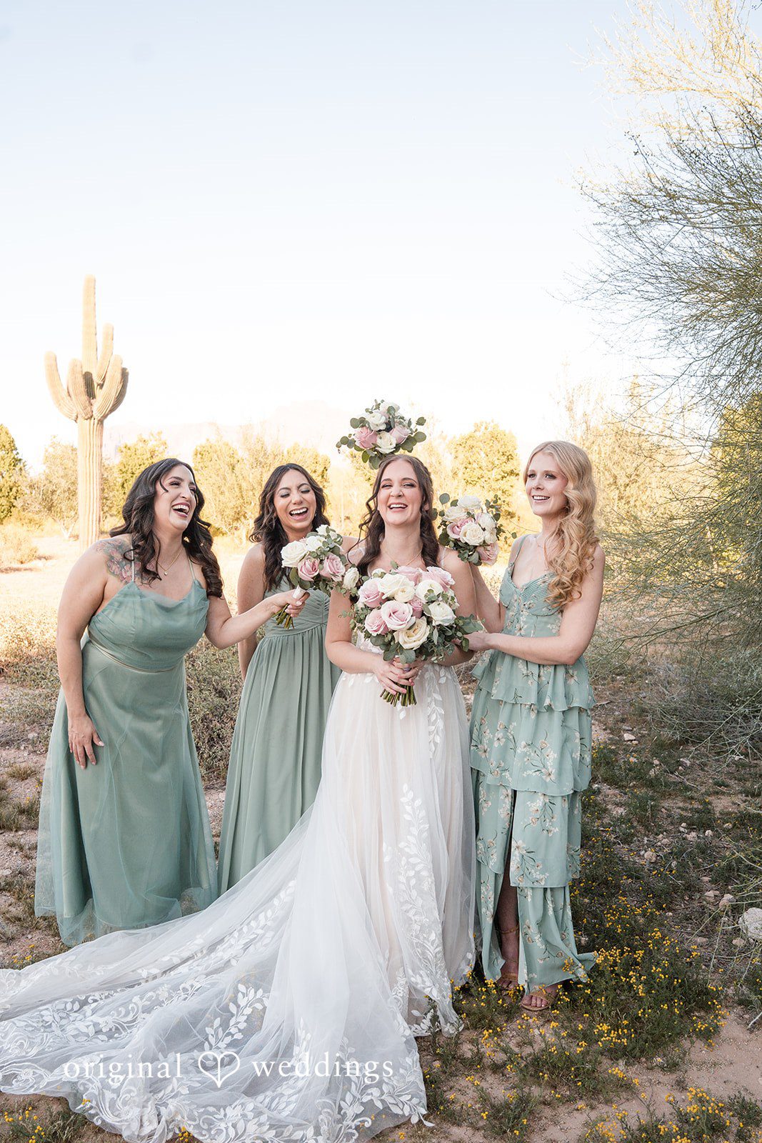 Jared + Jessica Picture of bride with bridesmaids holding bouquets and smiling