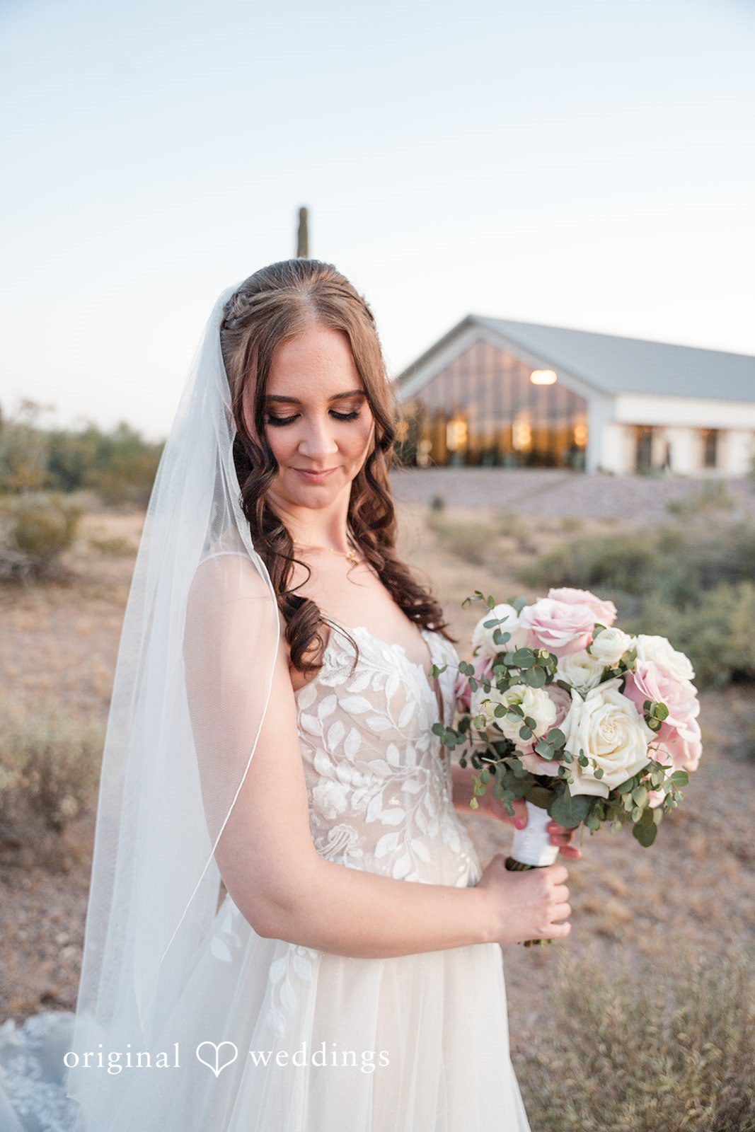 Jared + Jessica Beautiful solo shot of bride in her wedding gown holding bouquet