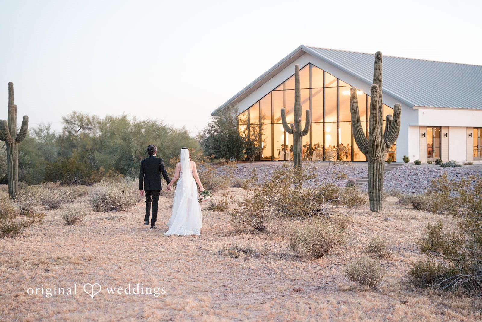 Jared + Jessica Picture of couple while walking away at Desert View Weddings & Events