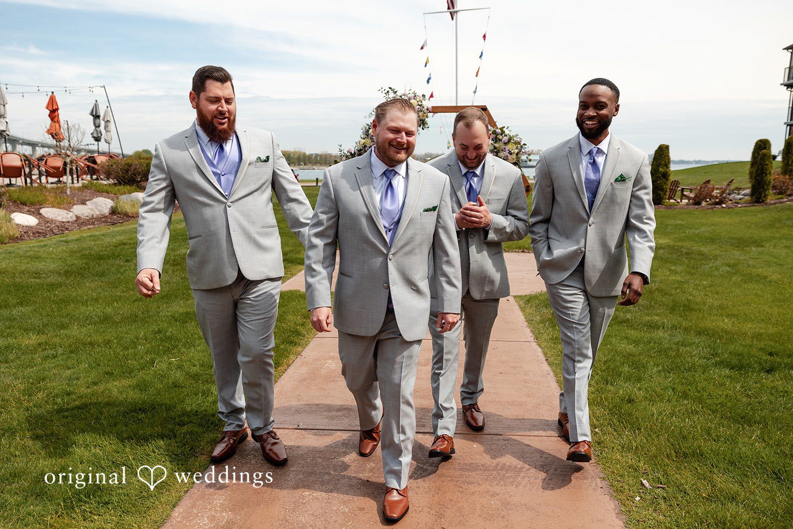 Katelyn + Bradley Groom with groomsmen walking outdoors before the ceremony