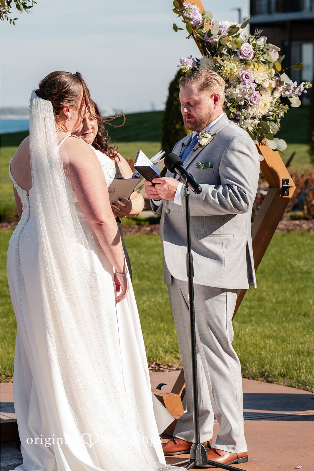 Katelyn + Bradley Groom reading his vows during the ceremony