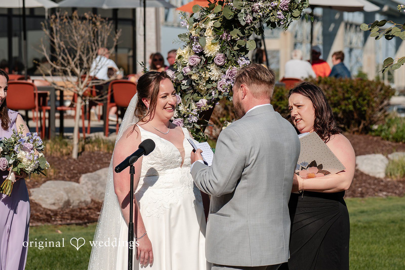 Katelyn + Bradley Groom reading his vows during the ceremony at DoubleTree by Hilton Port Huron.