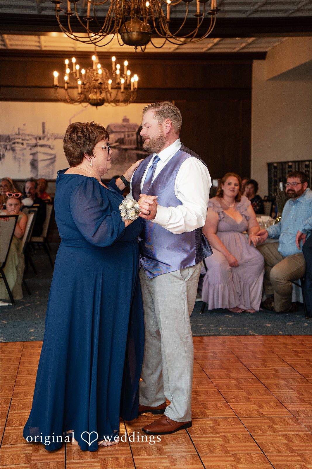 Katelyn + Bradley Groom sharing a dance with a woman in blue gown