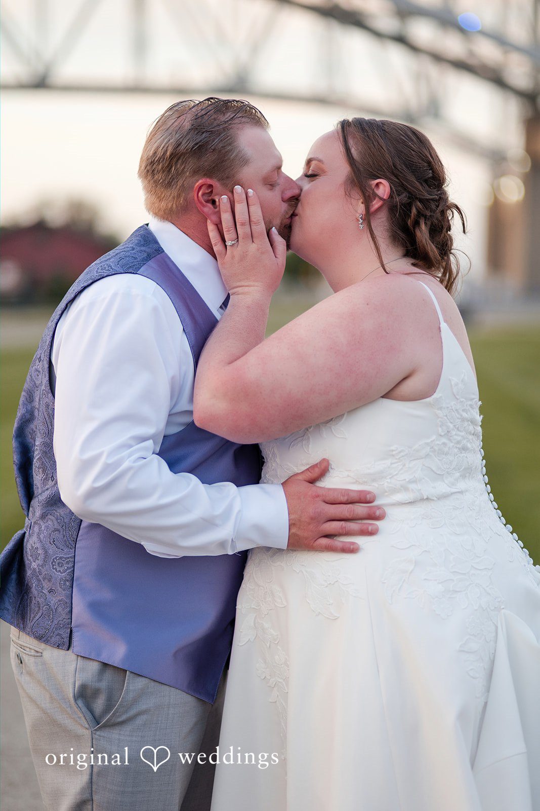 Katelyn + Bradley Bride and groom sharing a kiss during golden hour portrait