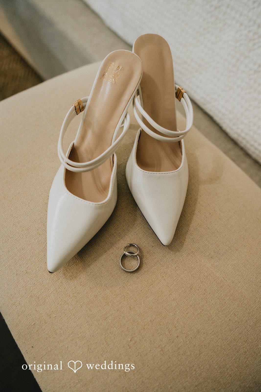 Sunny + Erika Bridal shoes and wedding rings on display