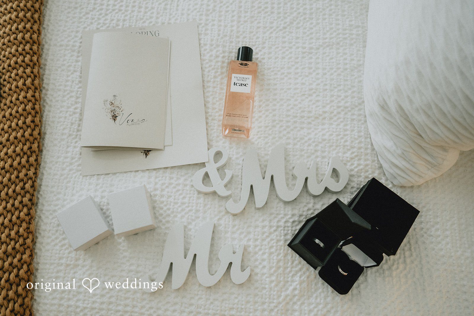 Sunny + Erika Wedding rings and letters arranged for a detail photo