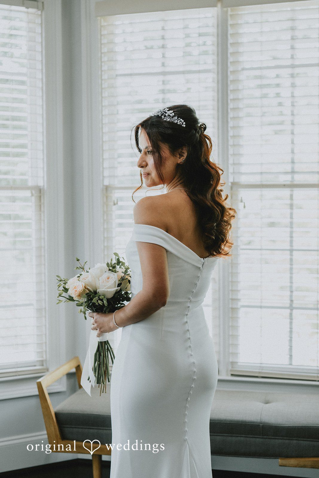 Sunny + Erika Bride holding her bouquet after getting ready