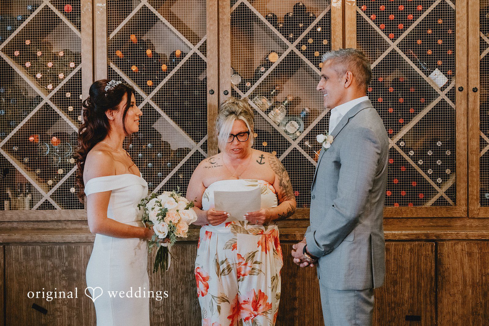 Sunny + Erika Bride and groom listening during the ceremony