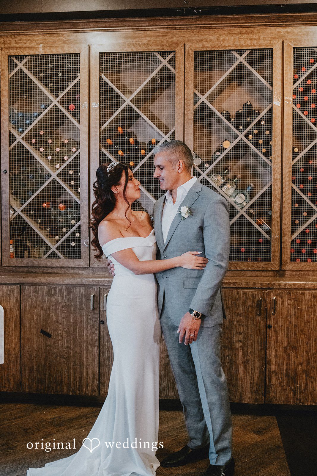 Sunny + Erika Bride and groom embracing after exchanging vows