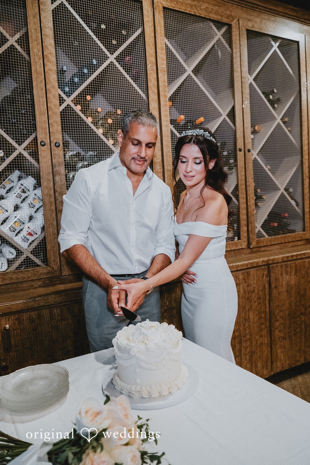 Sunny + Erika Bride and groom cutting their wedding cake