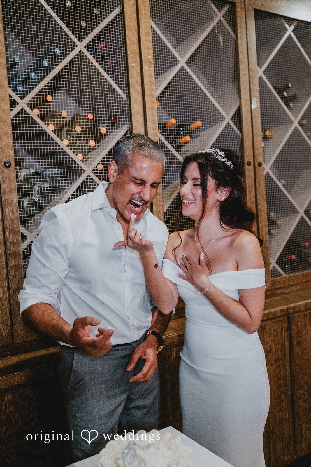 Sunny + Erika Bride and groom feeding each other cake