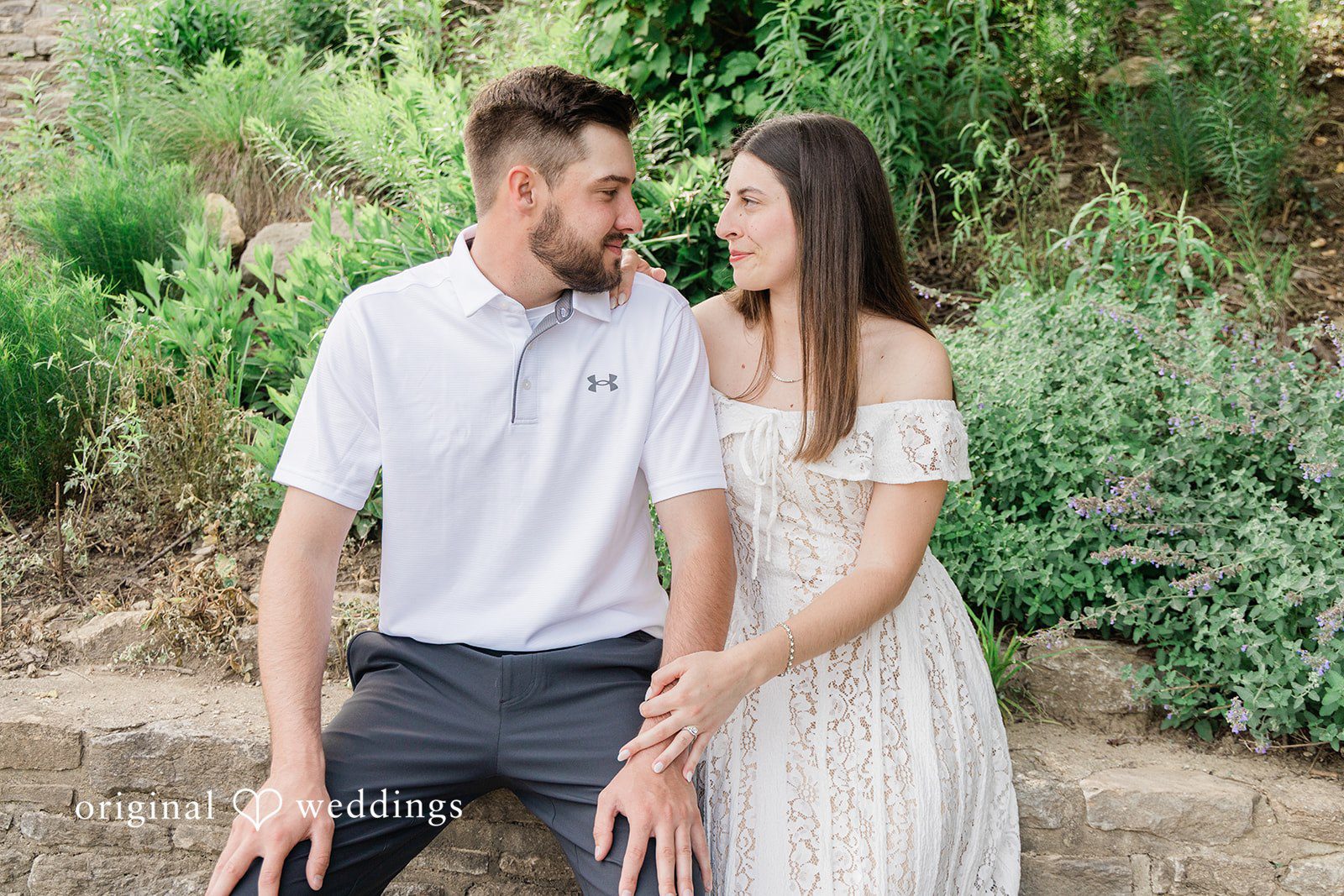Morgan + Griffin Couple sitting together during engagement photoshoot at Eden Park in Mt. Adams