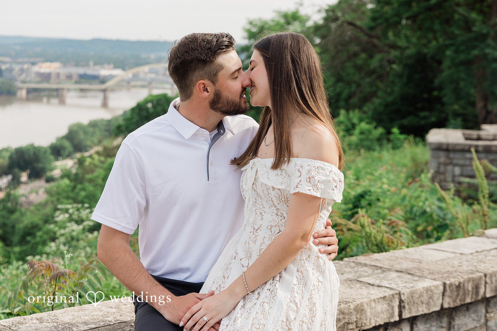 Morgan + Griffin Couple sharing a kiss at Eden Park in Mt. Adams