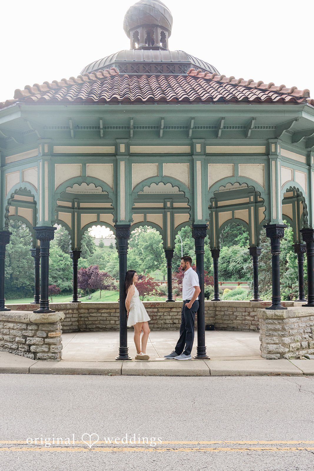 Morgan + Griffin Couple standing under gazebo at Eden Park in Mt. Adams captured by Cincinnati Engagement Photographers from Original Weddings