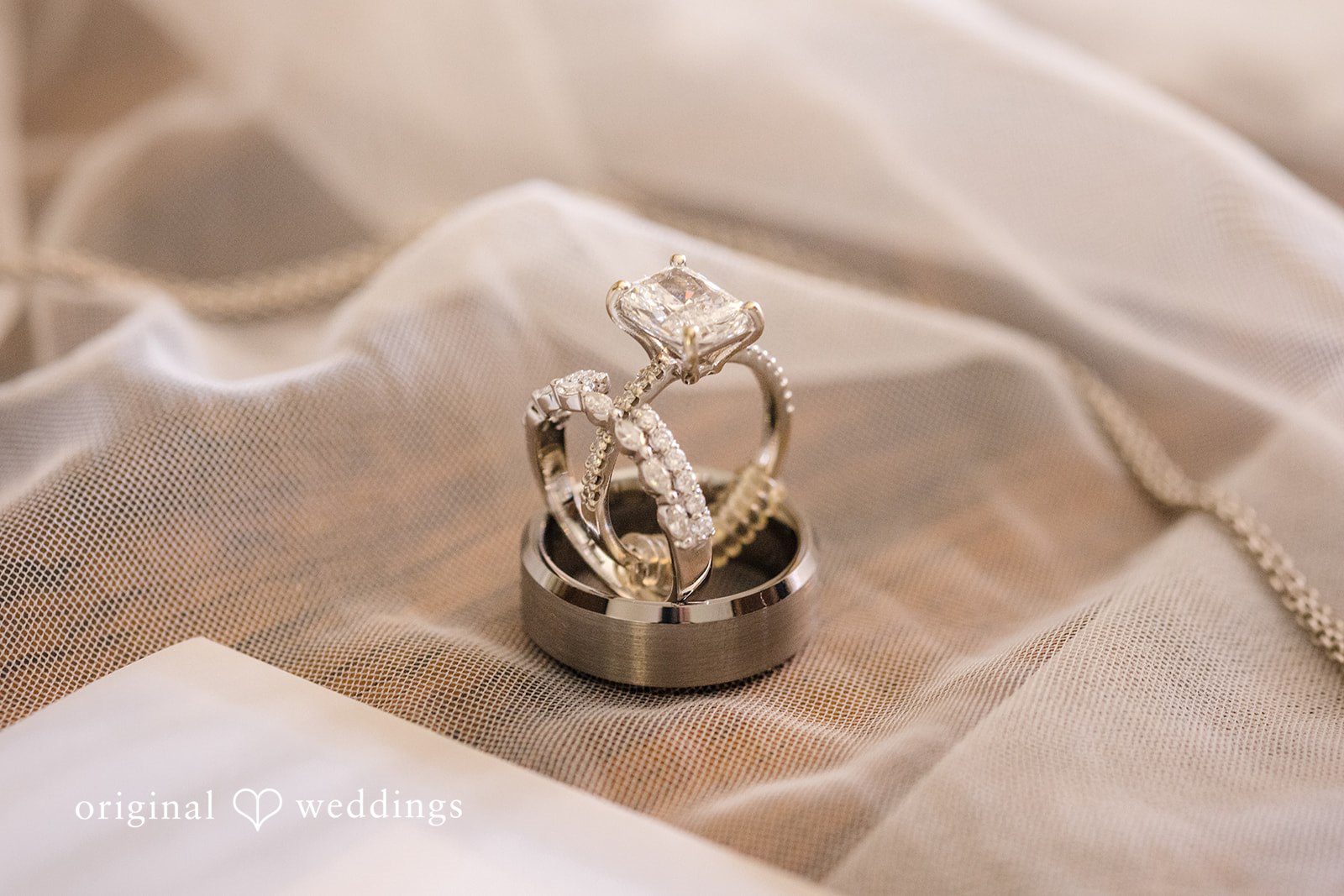 Wedding rings detail photo of the couple