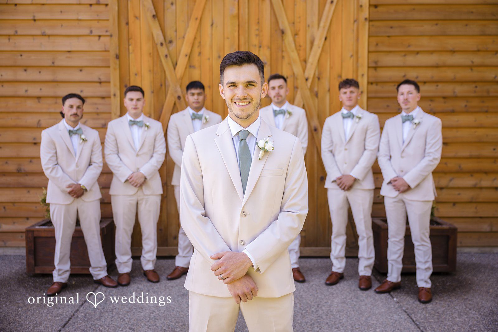 Groom posing with his groomsmen
