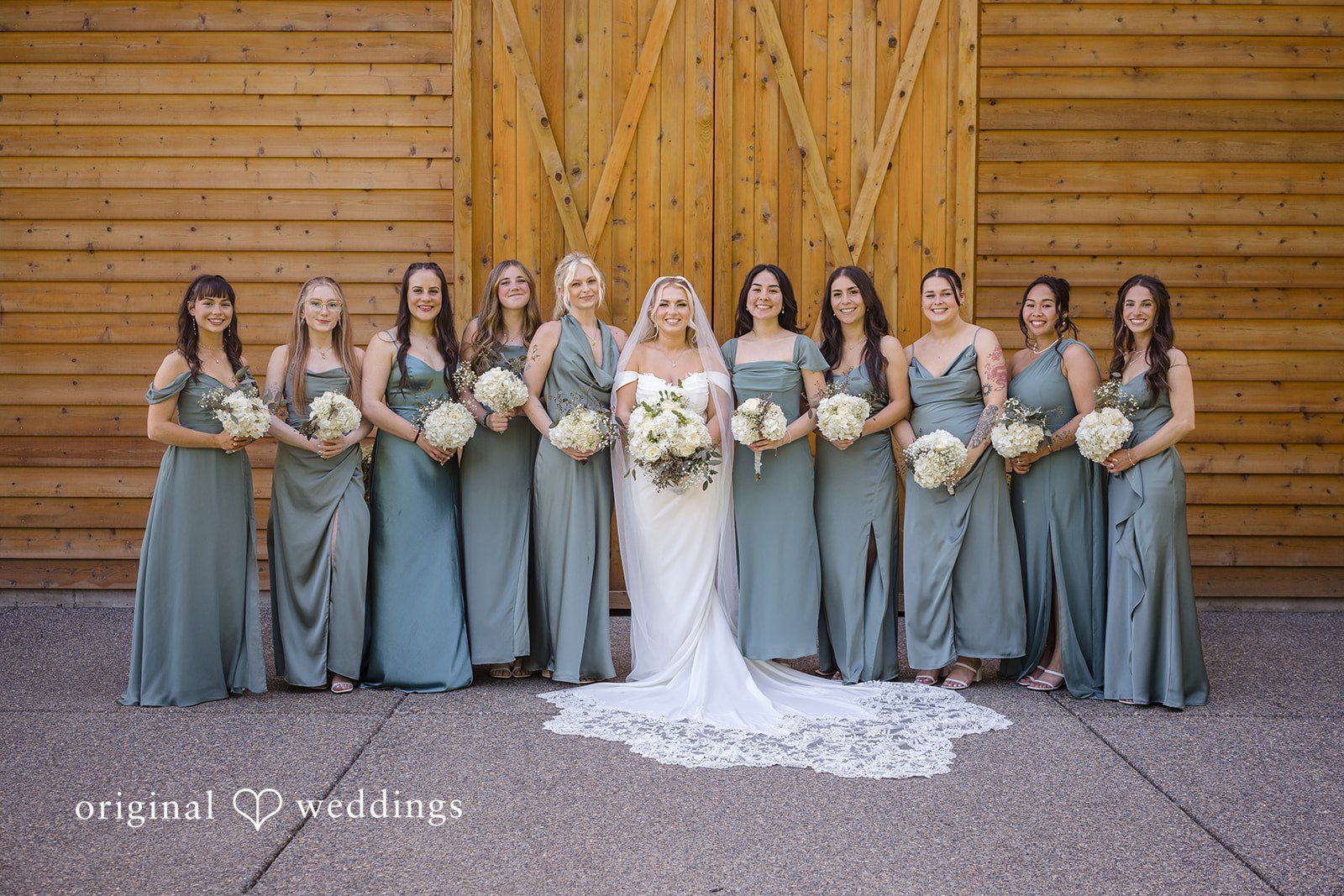 Bride posing with her bridesmaids