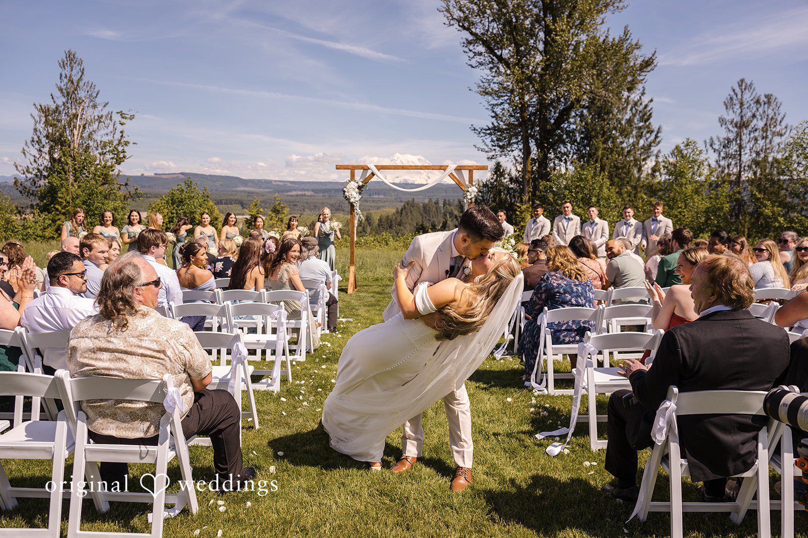 Newlyweds walking out of the ceremony area