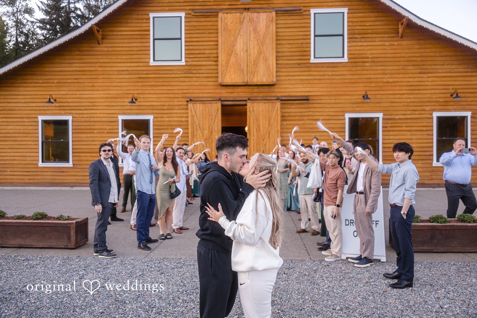 Bride and groom saying goodbye outside the venue