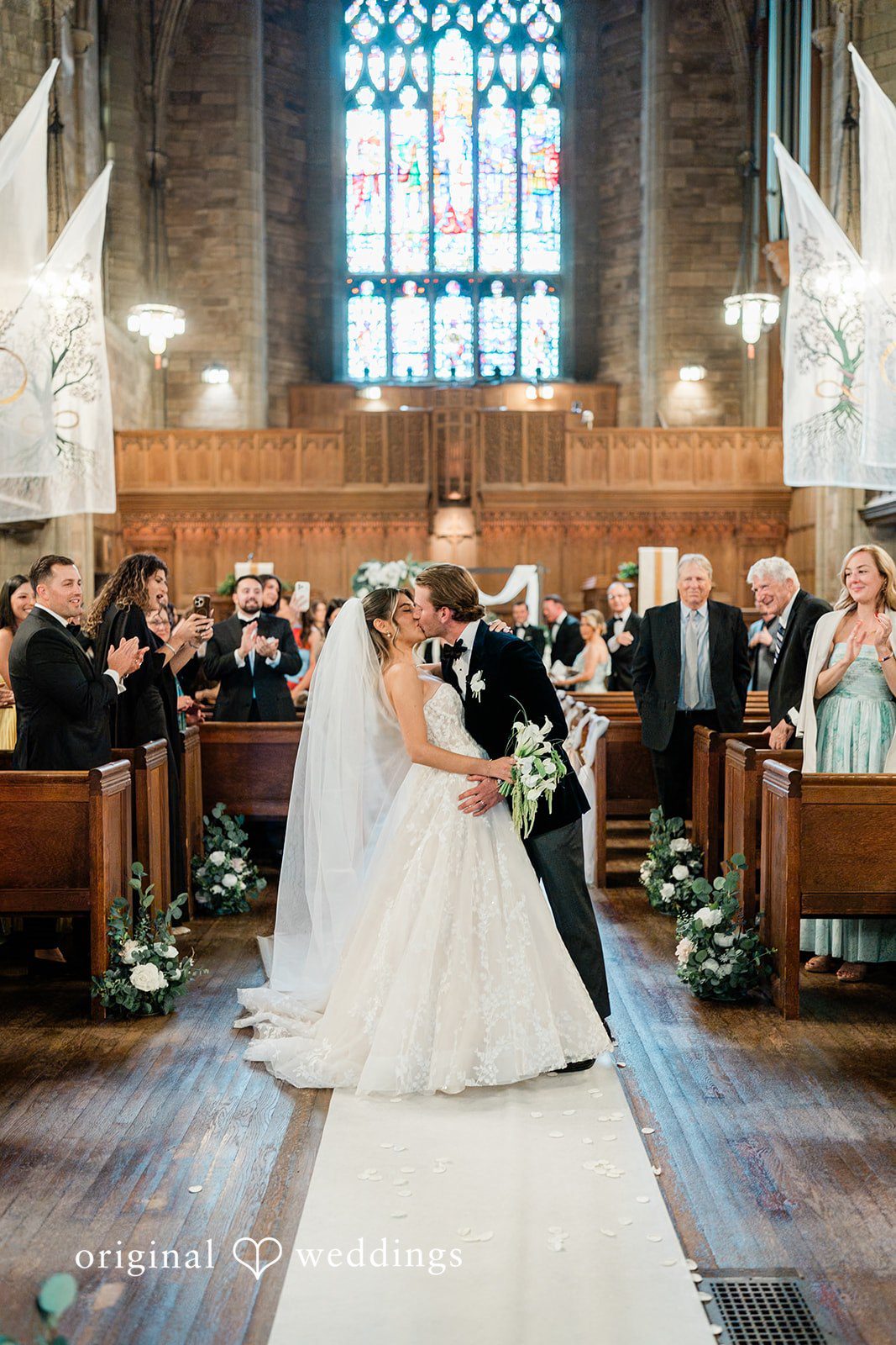 Bride and groom kissing each other at Essex Country Country Club.