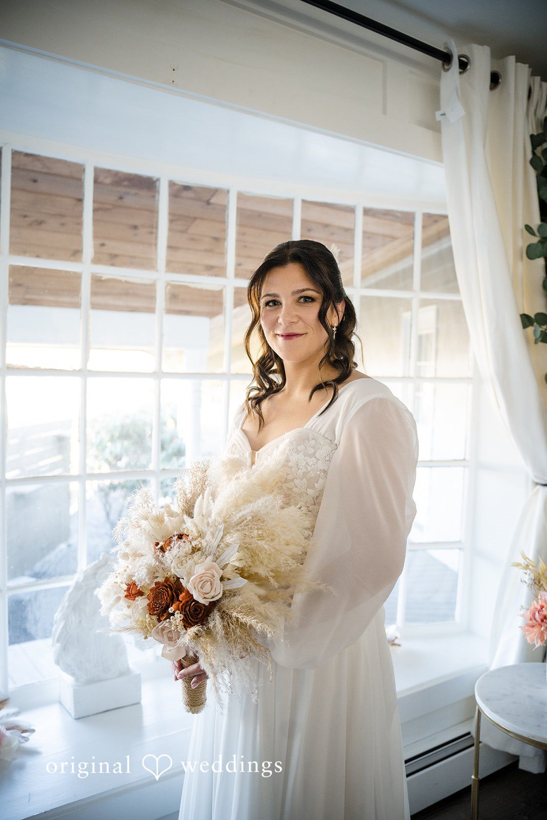 Carolyn + Robert Bride holding her bouquet while preparing for the ceremony.