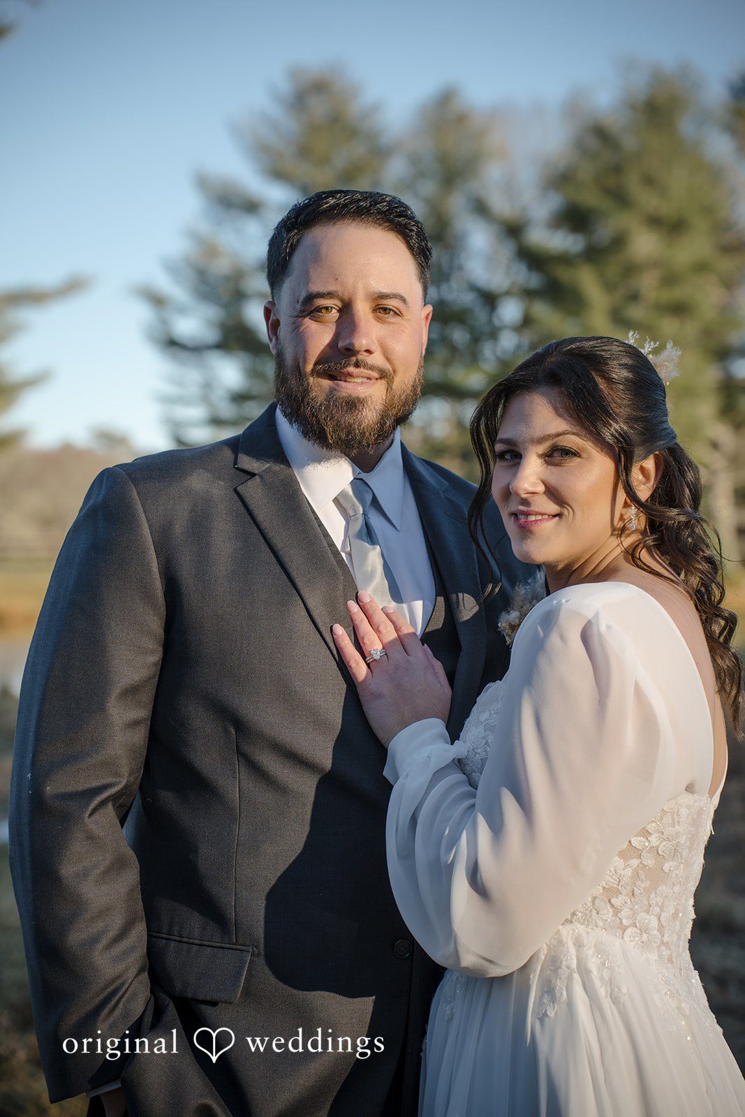 Carolyn + Robert Bride and groom embracing during a wedding portrait session.