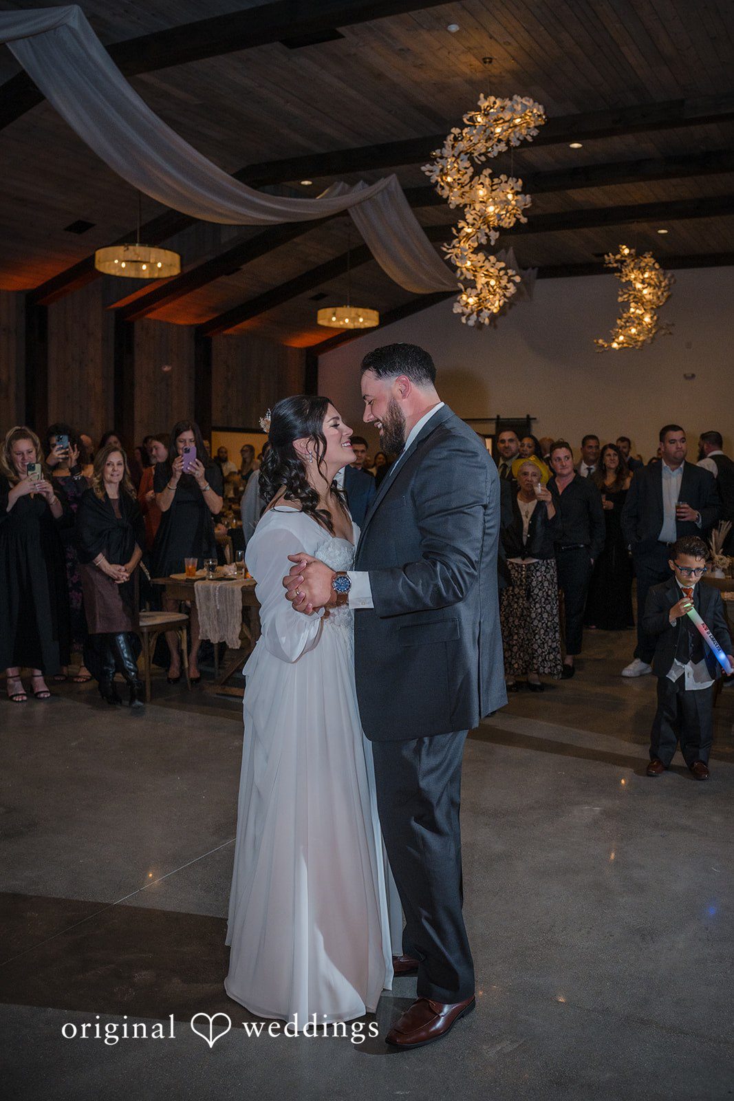Carolyn + Robert Bride and groom sharing their first dance at the wedding reception.